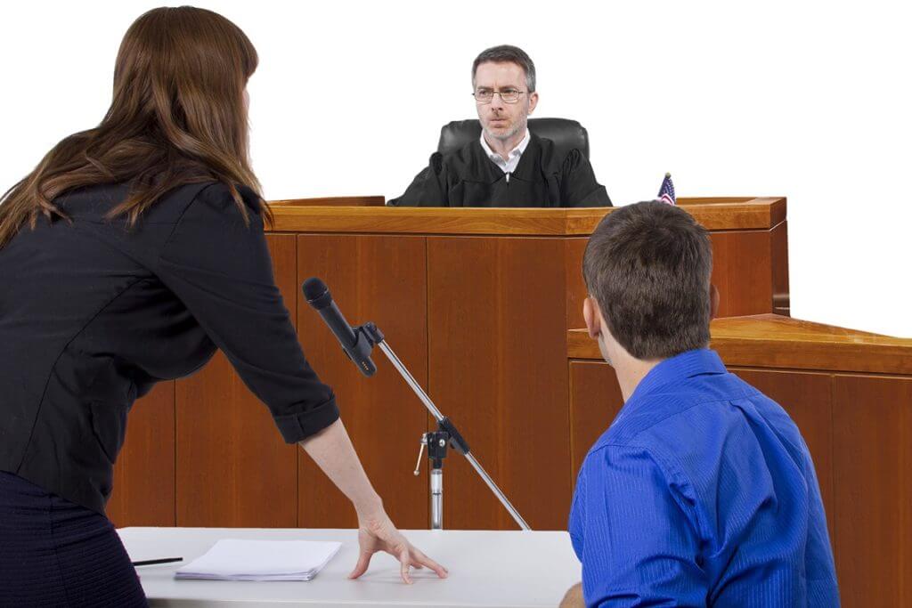 lawyer with client b4 judge.jpeg